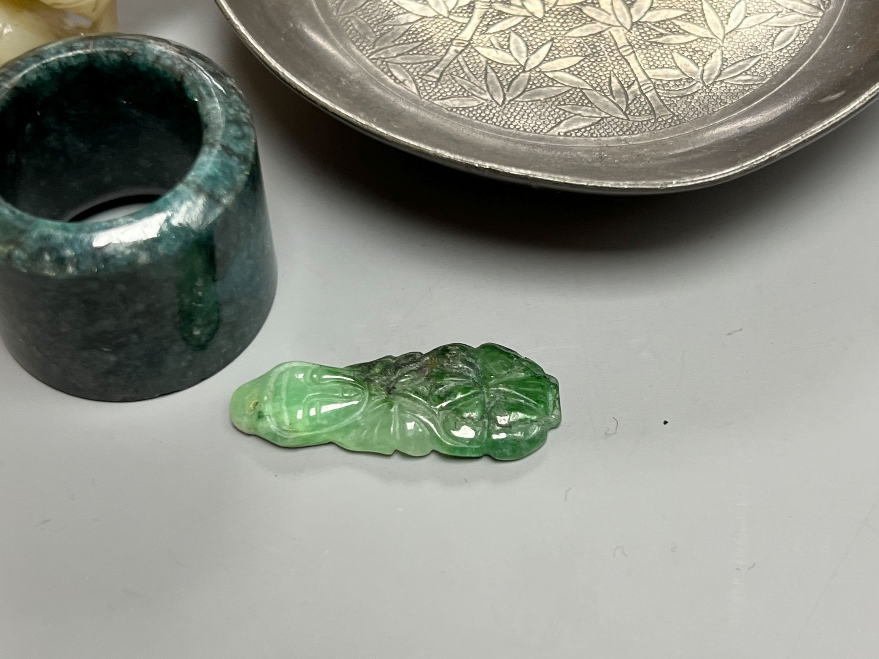 Assorted Chinese items including a jade figure, a jadeite pendant, pewter dish etc.